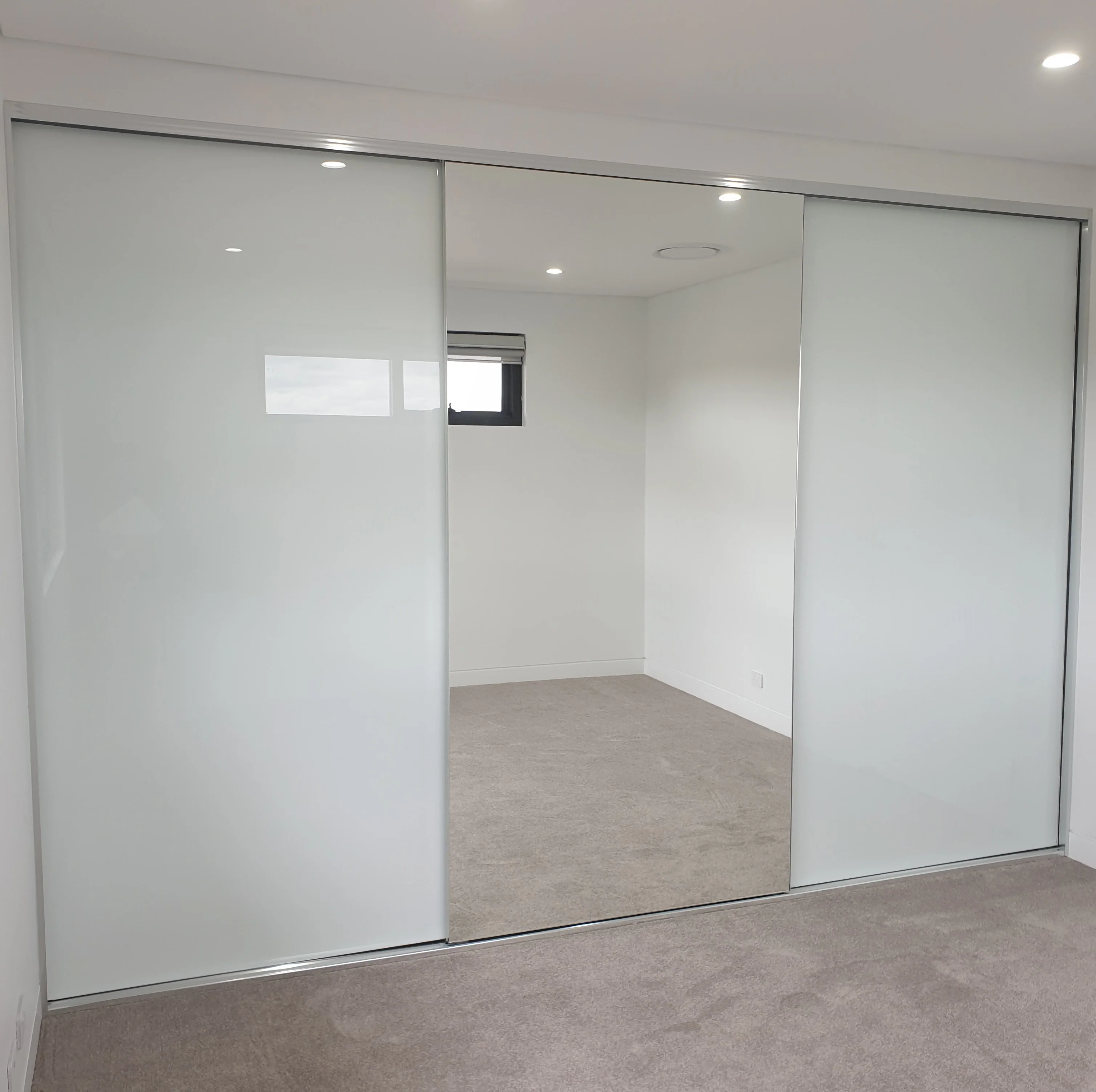 Frameless Mirror & Glass Wardrobe Sliding Doors From 2450mm Height Up To 2750mm Height by Trademaster